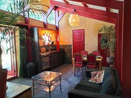 a living room with a couch and a table at Mus in Vierhuizen