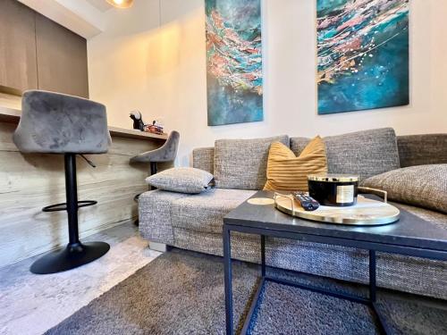 a living room with a couch and a table at Rab Downtown Place in Rab