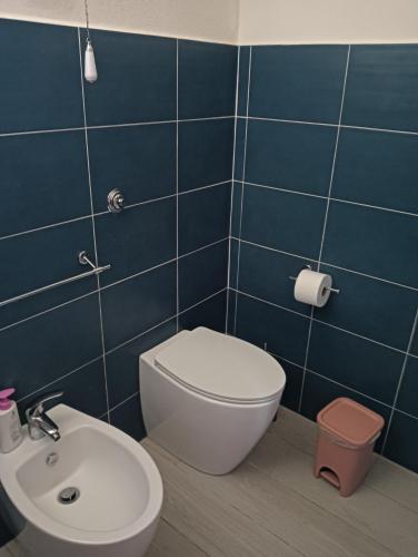 a bathroom with a toilet and a sink at Affittacamere San Martino in Orvieto