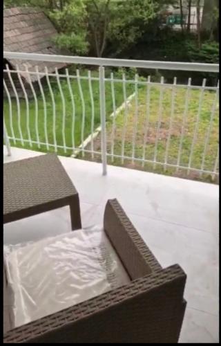 a bench and a table on a patio at Crater H in Kukrike