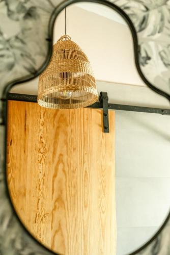 a reflection of a lamp in a mirror at Portugals Infinity Eco Suite Resort in Tavira