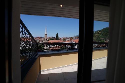 a balcony with a view of a city at Avdissons Hotel in Prizren