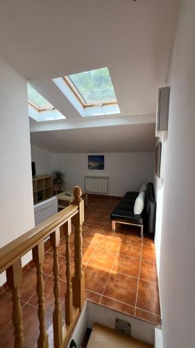 a living room with a skylight on the ceiling at Apartamentos el Olivo in Trias
