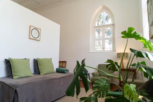 a living room with a couch and a window at The Old School in McGregor