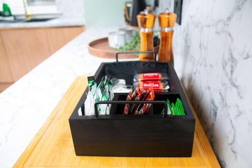 a black box sitting on top of a table at Sleeps 14 The Old Trafford Family Zen by Genesis Living in Manchester