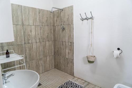 a bathroom with a shower and a sink at The Old School in McGregor