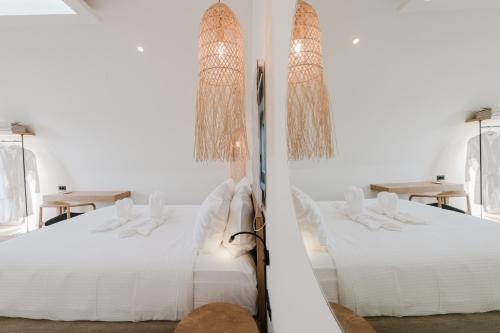Postel nebo postele na pokoji v ubytování Evexia boutique hotel & Spa