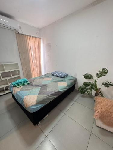 Ένα ή περισσότερα κρεβάτια σε δωμάτιο στο Loft Premium Gurupi 404