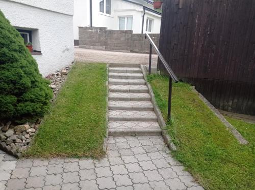 a set of stairs leading up to a house at Rekreačný dom E&Z in Brezno