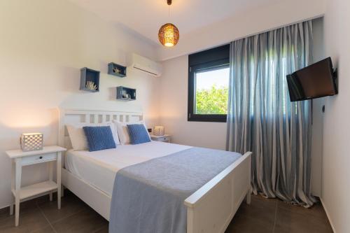Katil atau katil-katil dalam bilik di Prasonisi Villas