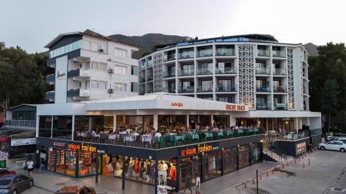 a building with a book store in front of a building at Class Unique Beach in Marmaris