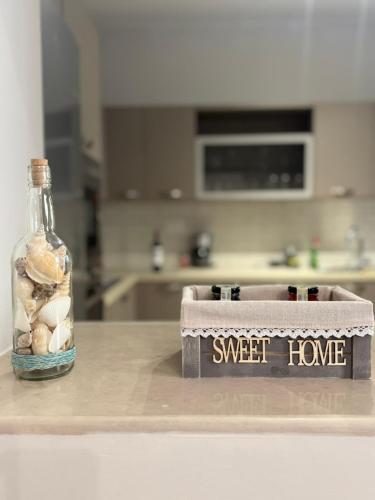 a jar of shells sitting on a counter in a kitchen at Anna's House in Kos Town