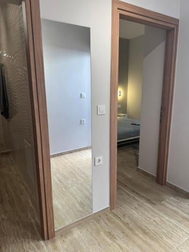 a mirror in a room with a bedroom at Anna's House in Kos Town