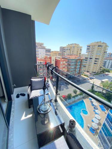 a balcony with a view of a pool on a building at Rubin residence in Alanya