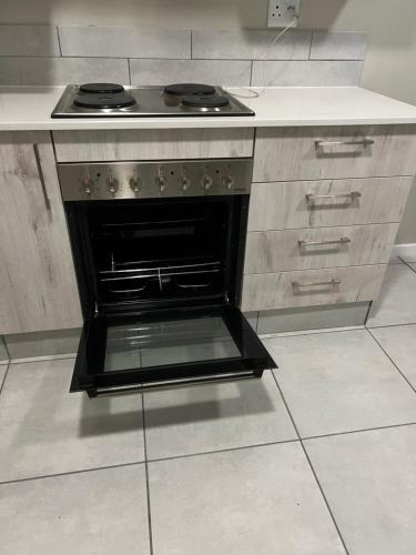 an oven in a kitchen with a counter top at One on Heather Midrand 