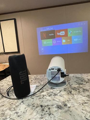 a speaker and a controller on top of a table at Willow Retreat in Walterboro