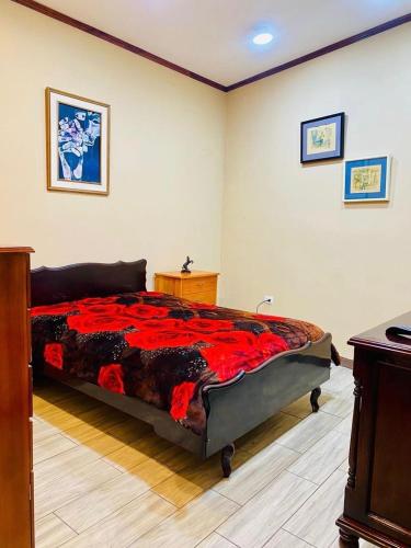 a bedroom with a large bed in a room at El Barco Colonial in Quito