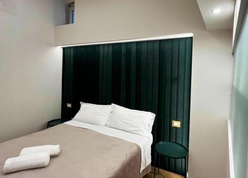 Ένα ή περισσότερα κρεβάτια σε δωμάτιο στο Motta Palace Apartments & Rooms