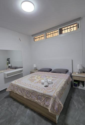 a bedroom with a bed in a white room at Chouf View Residence in Baddah