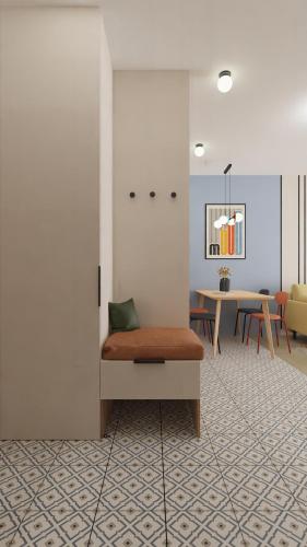 a living room with a couch and a table at Jurowiecka 22 ORANGE Centrum Modern Apartment in Białystok