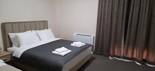 Ένα ή περισσότερα κρεβάτια σε δωμάτιο στο SEE YOU Apartments