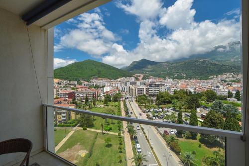 a view of a city from a balcony at Apartments Menuet in Budva
