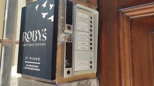 a radio box on the side of a building at Roby's Boutique Rooms - Luxury B&B in Catania
