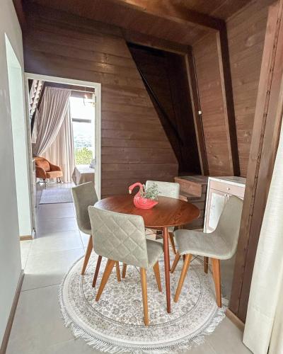a dining room with a table and chairs at Hotel Fazenda RosaBlue in Presidente Getúlio