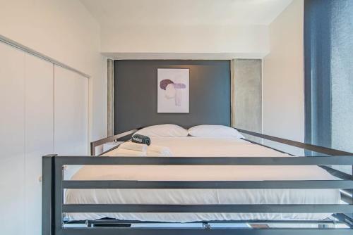 a large bed in a bedroom with at Detailed 2BD, HighRise DT, Pool, Gym, Parking, Sleeps 5 in Phoenix