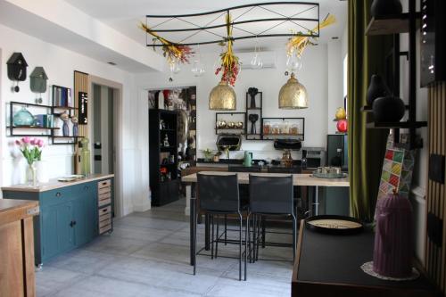 a kitchen with a table and chairs in it at Roby's Boutique Rooms - Luxury B&B in Catania