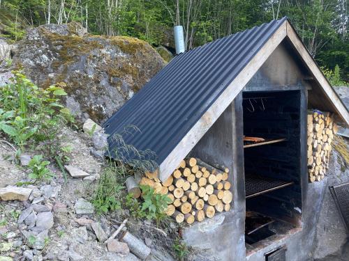 a pile of fire wood in a wood stove at Sea view Holmestrand sauna and hot tube appartment in Holmestrand