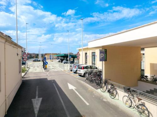 a street with cars parked in a parking lot at Virginia Madre Luxury Rooms in San Benedetto del Tronto
