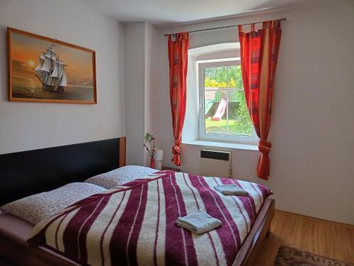 Postel nebo postele na pokoji v ubytování Apartmány Merkel