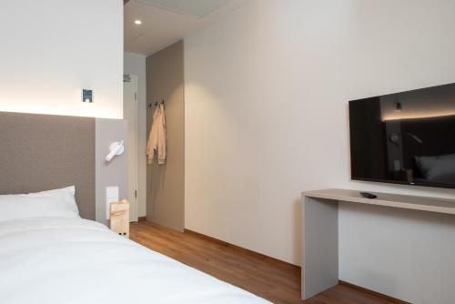 Postel nebo postele na pokoji v ubytování RELAXANS Wellness & Hotel