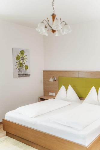 Ένα ή περισσότερα κρεβάτια σε δωμάτιο στο SEENZeit Apartments