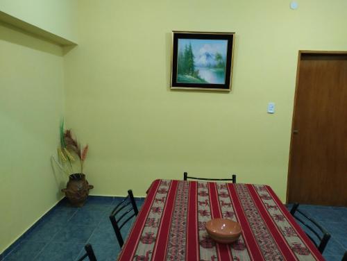 a dining room with a table with a bowl on it at Departamento El Inca 2 in Fiambala