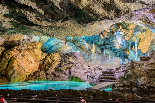 a cave with a painting on the wall at Hotel Appartementanlage Hermannshöhle in Elbingerode