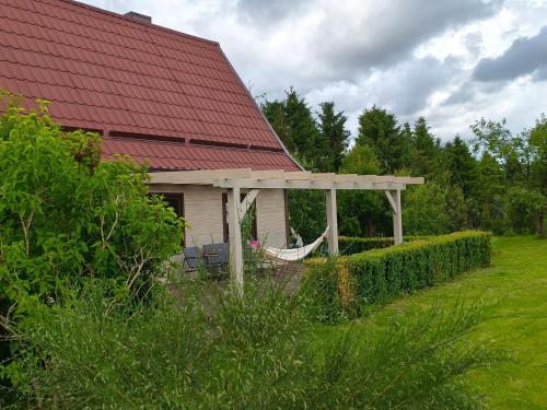 a house with a gazebo in a yard at Domek na Kaszubach w Pomysku Małym in Soszyca