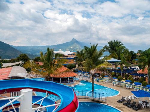 a view of the pool at a resort at HCR Hotel y Centro de Convenciones Chinauta Real in Fusagasuga
