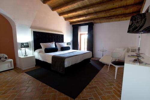 Ένα ή περισσότερα κρεβάτια σε δωμάτιο στο Hotel Boutique Convento San Diego
