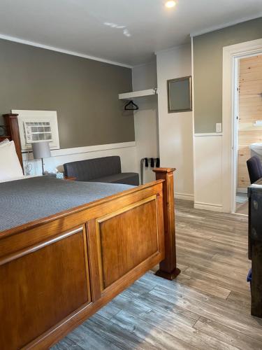a hotel room with a bed and a couch at Greenside Motel in Saint Andrews