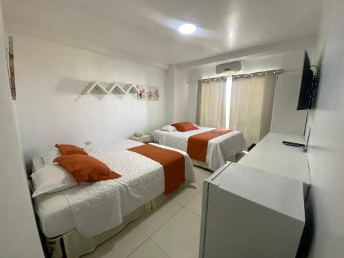 Ένα ή περισσότερα κρεβάτια σε δωμάτιο στο Hotel Santa Fe