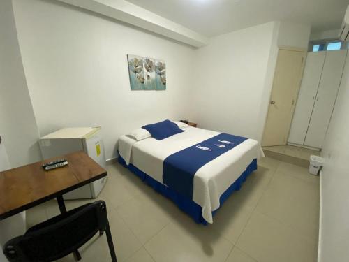 Ένα ή περισσότερα κρεβάτια σε δωμάτιο στο Hotel Santa Fe