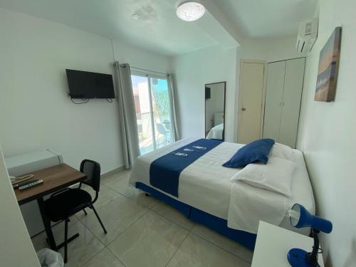 Ένα ή περισσότερα κρεβάτια σε δωμάτιο στο Hotel Santa Fe