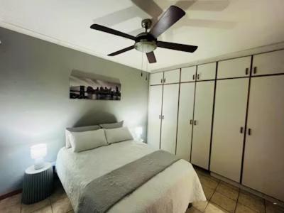 a bedroom with a bed and a ceiling fan at Prospect in Ceres