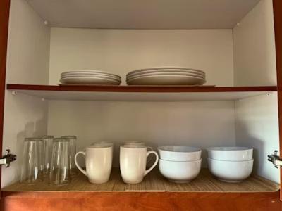 a shelf with bowls and cups and plates on it at Prospect in Ceres