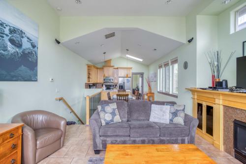 a living room with a couch and a fireplace at Coastal Dream in Lincoln City