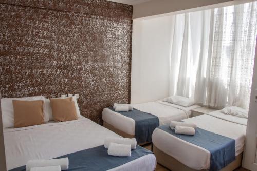 Ένα ή περισσότερα κρεβάτια σε δωμάτιο στο Toros Otel Didim