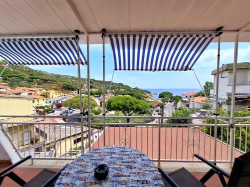 a balcony with a view of a city at La casa di Grace in Seccheto