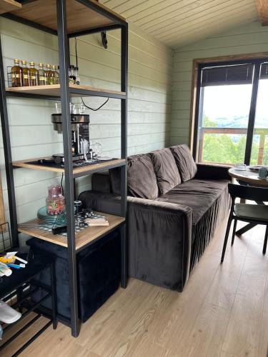 a living room with a couch and a table at Kosuli in Oriv